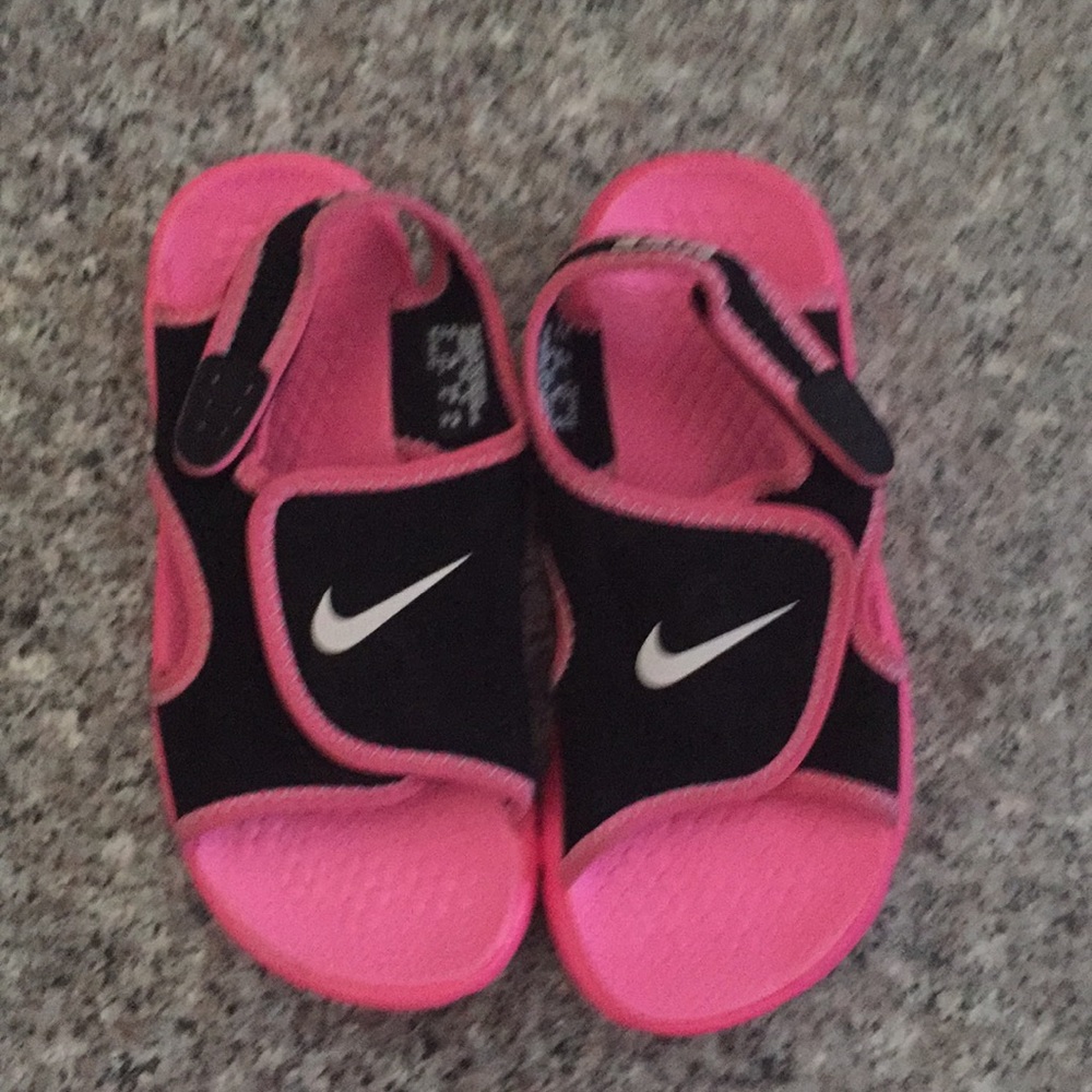 A Pink and Black Nike Sandal